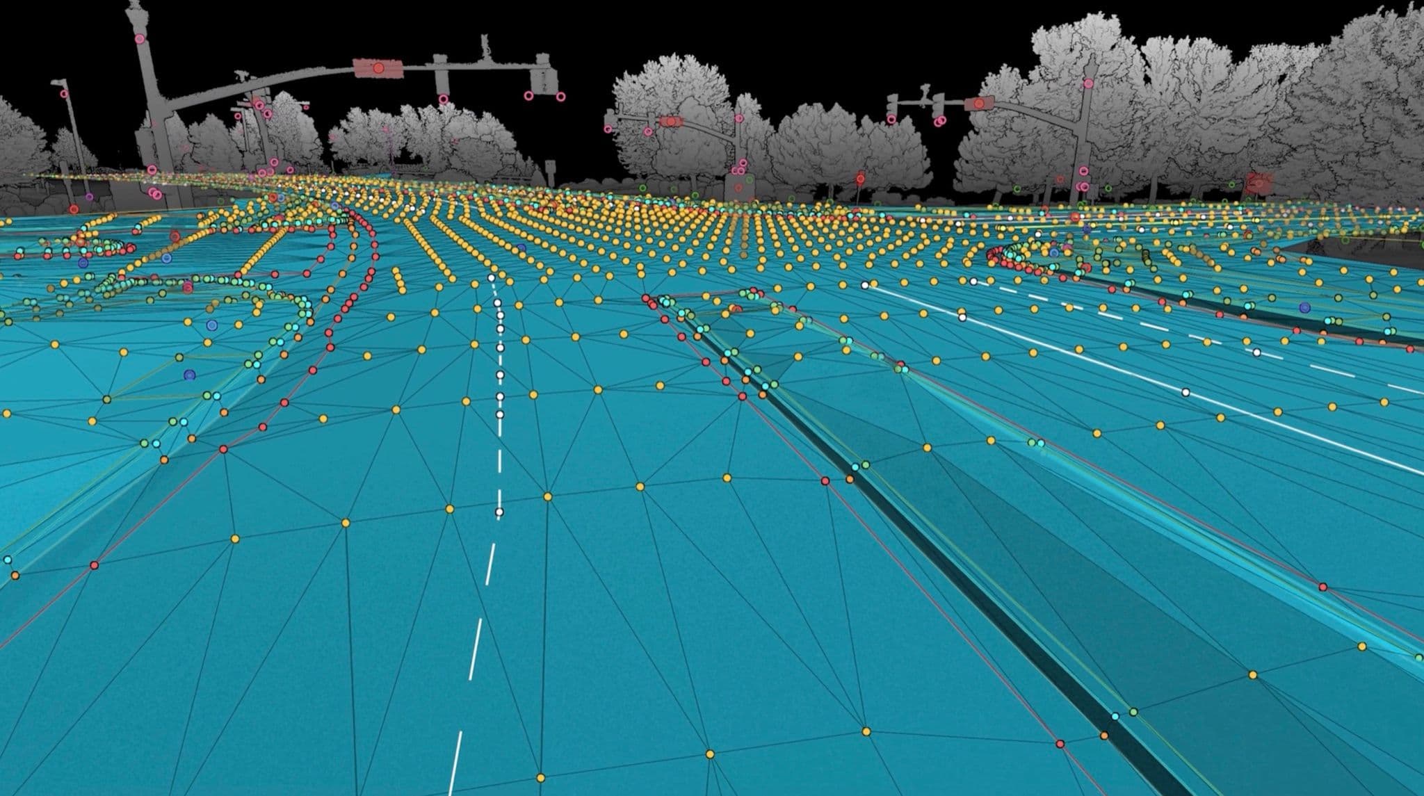 TIN mesh generated from extracted ground points and linework at a roadway intersection, rendered over the point cloud