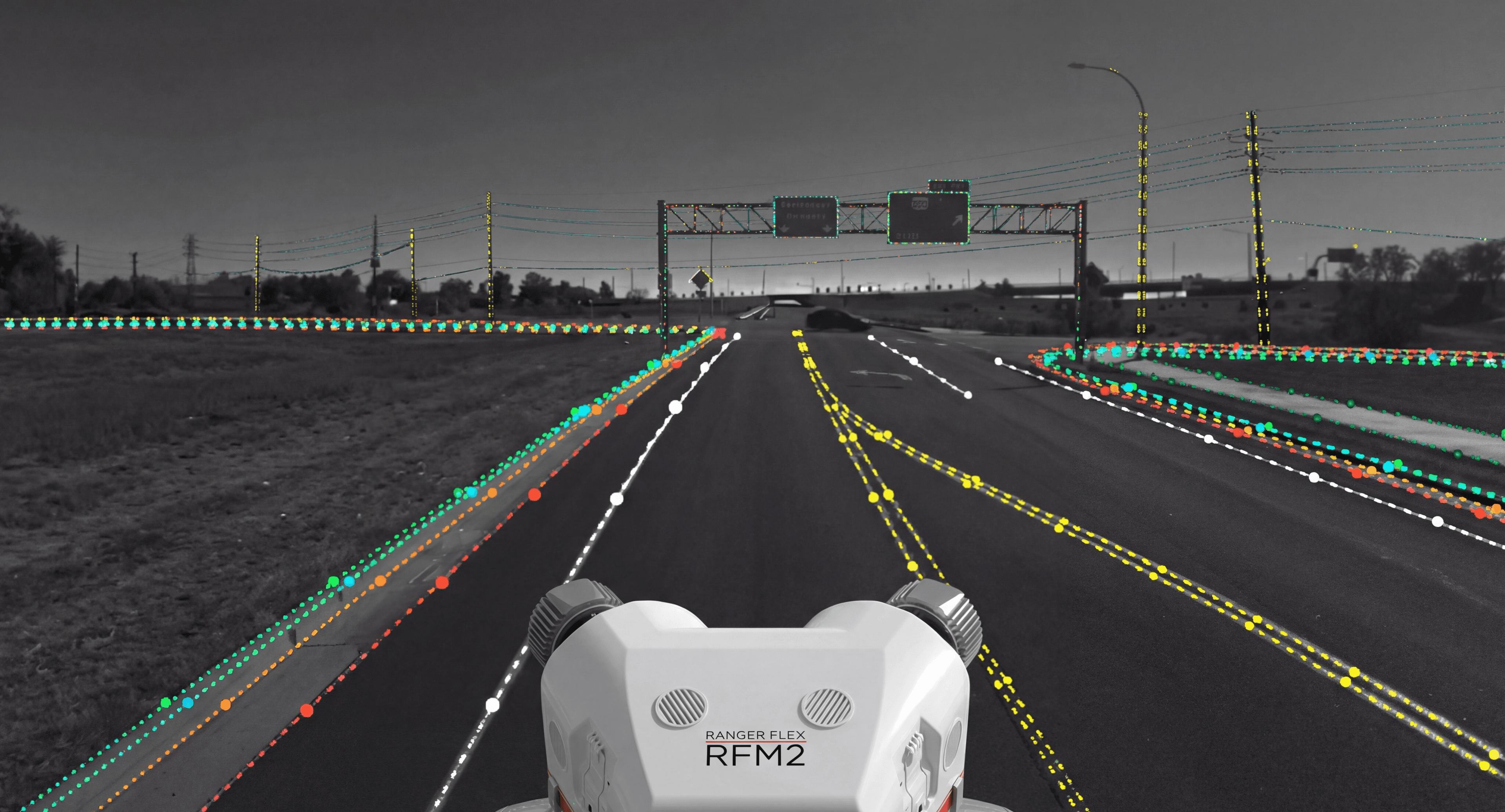 Phoenix LiDAR Ranger Flex RFM2 mobile mapping system with colorized point cloud overlay on a highway